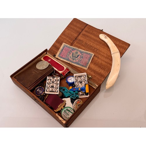 77 - Mixed lot, a Vintage cigar box containing militaria, badges sporting items and a medal etc.

This lo... 