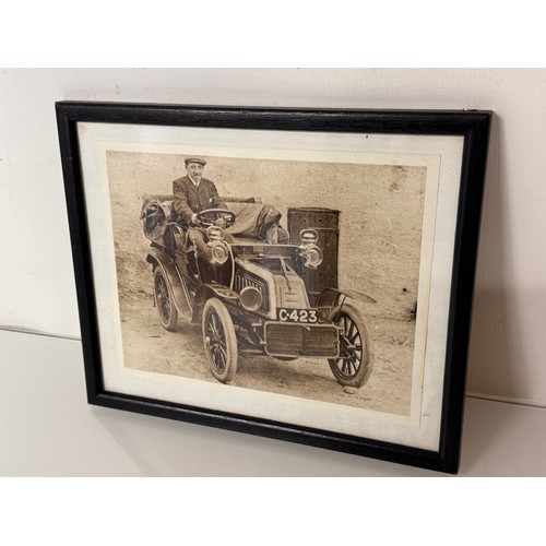 82 - Automobilia, a framed photograph of a gentleman in a veteran motor car.

This lot is available for i... 