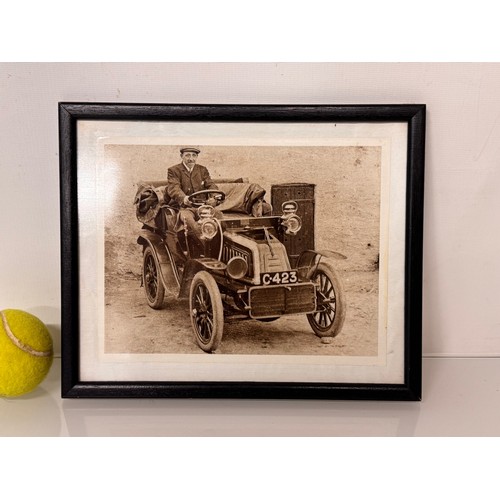 82 - Automobilia, a framed photograph of a gentleman in a veteran motor car.

This lot is available for i... 