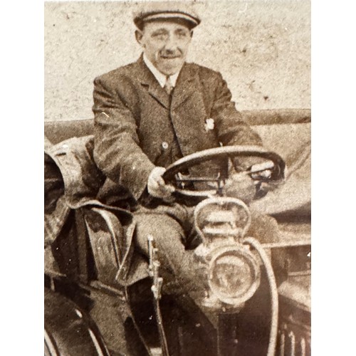 82 - Automobilia, a framed photograph of a gentleman in a veteran motor car.

This lot is available for i... 