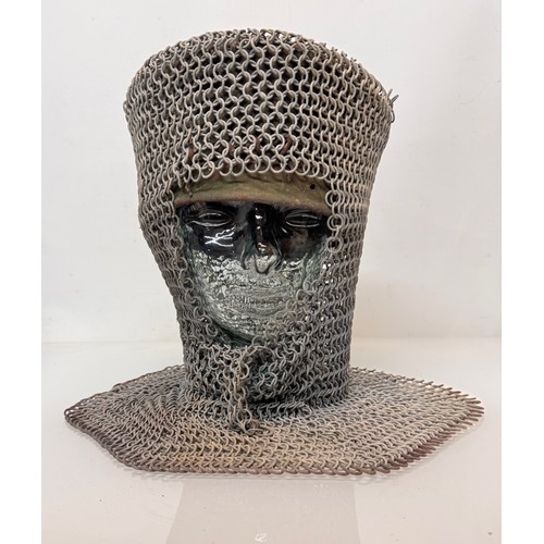 216 - Militaria, re-enactment uniforms, a chain-mail Crusaders style helmet.

This lot is available for in... 