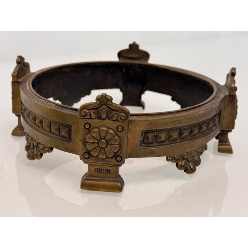 227 - Cast brass circular stand, 16 cm in diameter.

This lot is available for in-house shipping.