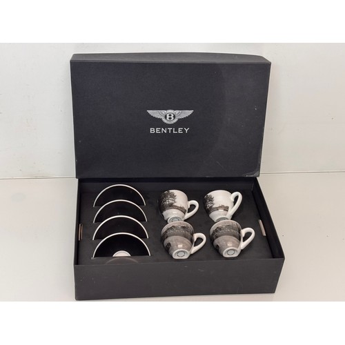 268 - Automobilia, Bentley motor cars official merchandise, a boxed set of coffee cups illustrated with 19... 