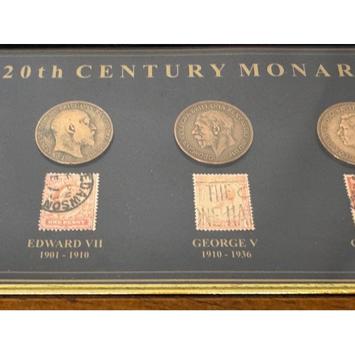 271 - Coins and Stamps, a commemorative framed group showning the English monarchs through the C20th centu... 