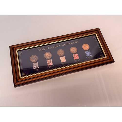 271 - Coins and Stamps, a commemorative framed group showning the English monarchs through the C20th centu... 