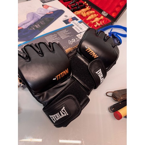 114 - Mixed lot, extending selfie camera stick, new inflatable mattress, chess set, pair of MMA fighting g... 