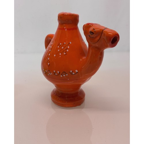 124 - Ceramic jug in the form of a camel with a decorated orange glaze, 18cm tall.

This lot is available ... 