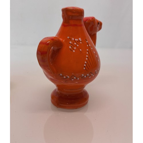 124 - Ceramic jug in the form of a camel with a decorated orange glaze, 18cm tall.

This lot is available ... 