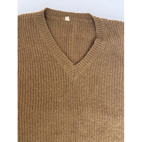 249 - Militaria, military clothing a US Army issue woolen tank top.

This lot is available for in-house sh... 