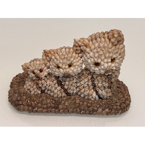 256 - Mid century kitsch shell decorated figurine of three kittens.

This lot is available for in-house sh... 