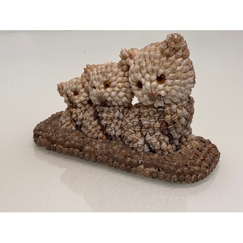 256 - Mid century kitsch shell decorated figurine of three kittens.

This lot is available for in-house sh... 