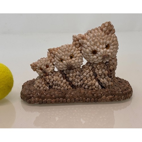 256 - Mid century kitsch shell decorated figurine of three kittens.

This lot is available for in-house sh... 