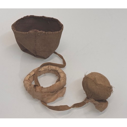 326 - Ethic art, toys and games, an Inuit made ball and hoop game in a small fabric bag.

This lot is avai... 