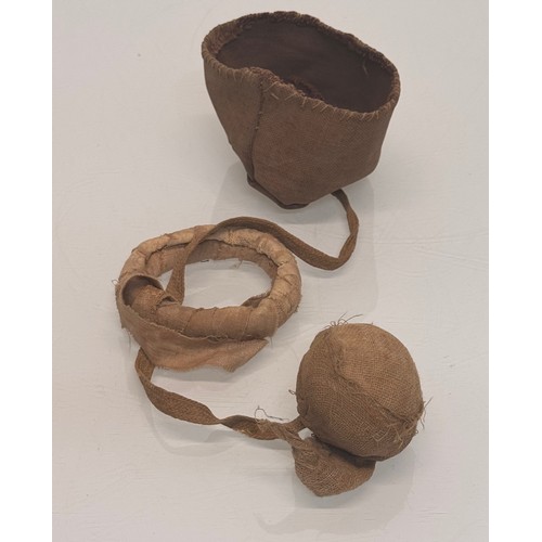 326 - Ethic art, toys and games, an Inuit made ball and hoop game in a small fabric bag.

This lot is avai... 