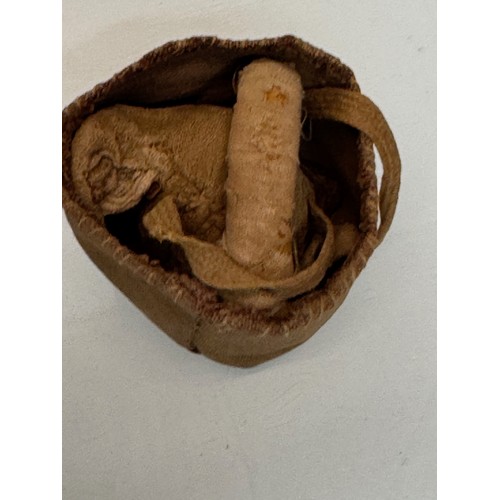 326 - Ethic art, toys and games, an Inuit made ball and hoop game in a small fabric bag.

This lot is avai... 