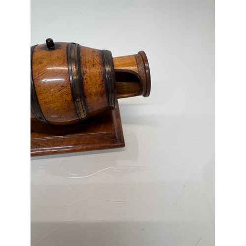 71 - Treen, Match box, in the form of a brass bound barrel on a plinth, sprung end opens for access to th... 