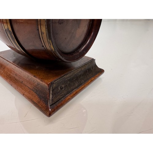 71 - Treen, Match box, in the form of a brass bound barrel on a plinth, sprung end opens for access to th... 