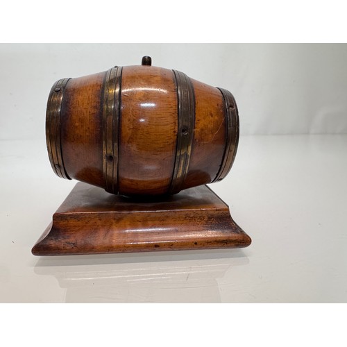 71 - Treen, Match box, in the form of a brass bound barrel on a plinth, sprung end opens for access to th... 