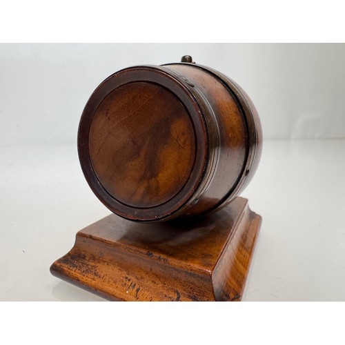 71 - Treen, Match box, in the form of a brass bound barrel on a plinth, sprung end opens for access to th... 