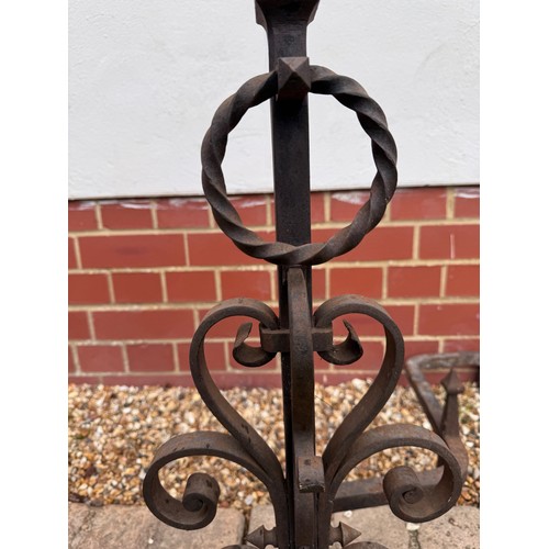 97 - Fire dogs, a pair of large wrought iron fire dogs each 76 cm tall x 52 cm deep and 57 cm wide.

This... 