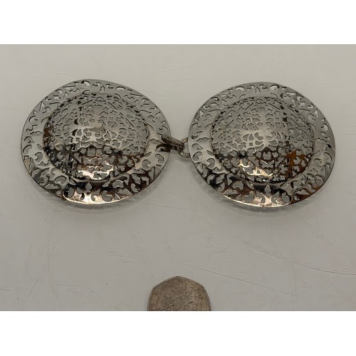 33 - Large white metal belt buckle.

This lot is available for in-house shipping.