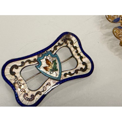 36 - A collection of buckles, silver and enamelled examples and a some linked coins.

This lot is availab... 