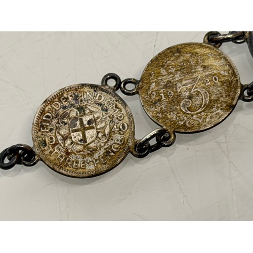 36 - A collection of buckles, silver and enamelled examples and a some linked coins.

This lot is availab... 