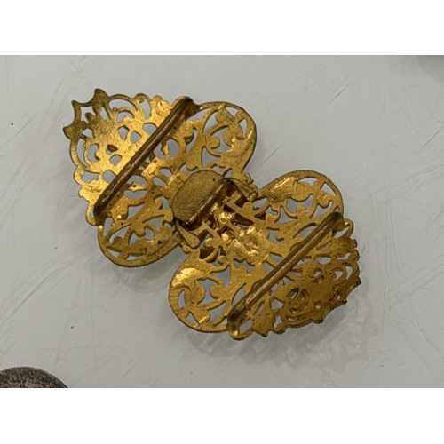 36 - A collection of buckles, silver and enamelled examples and a some linked coins.

This lot is availab... 