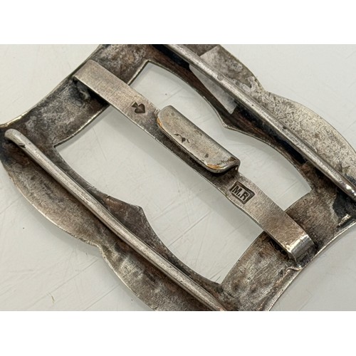 36 - A collection of buckles, silver and enamelled examples and a some linked coins.

This lot is availab... 