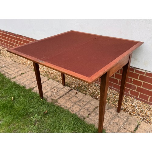 42 - Unusual mid century teak furniture, a table with a rotating folding top and hidden storage compartme... 