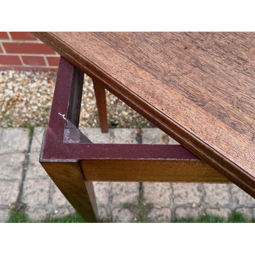 42 - Unusual mid century teak furniture, a table with a rotating folding top and hidden storage compartme... 