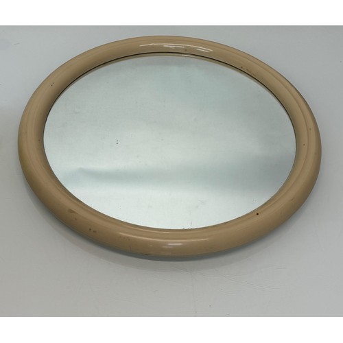 49 - Mid century furniture, a circular framed wall mirror.

This lot is available for in-house shipping