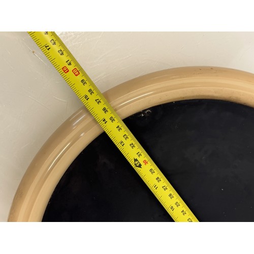 49 - Mid century furniture, a circular framed wall mirror.

This lot is available for in-house shipping