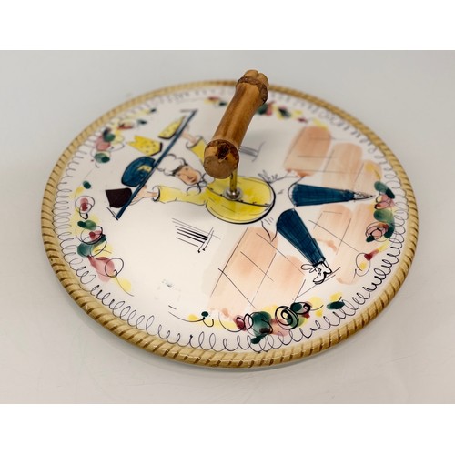 52 - Mid century table wares, a kitch serving platter decorated with an image of a jolly chef, 21 cm in d... 