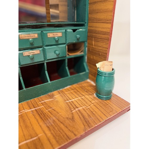 56 - Toys and games, a dolls house type shop counter, 37 cm wide x 41 cm tall x 23 cm deep.

This lot is ... 