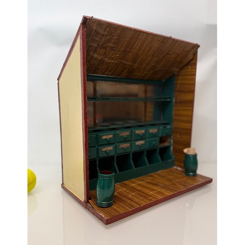 56 - Toys and games, a dolls house type shop counter, 37 cm wide x 41 cm tall x 23 cm deep.

This lot is ... 
