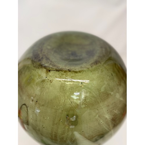 57 - A early C20th century green glass carboy, 35 cm in dia x 40 cm tall.

This lot is collection only