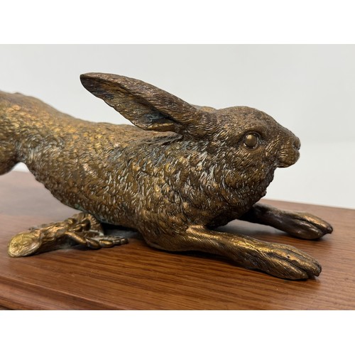 7 - Austrian school C19th century bronze, a cast and sprung paper clip in the form of a leaping hare, de... 