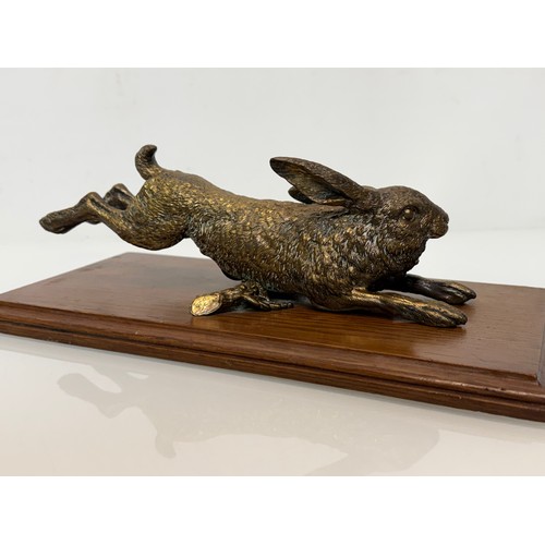 7 - Austrian school C19th century bronze, a cast and sprung paper clip in the form of a leaping hare, de... 