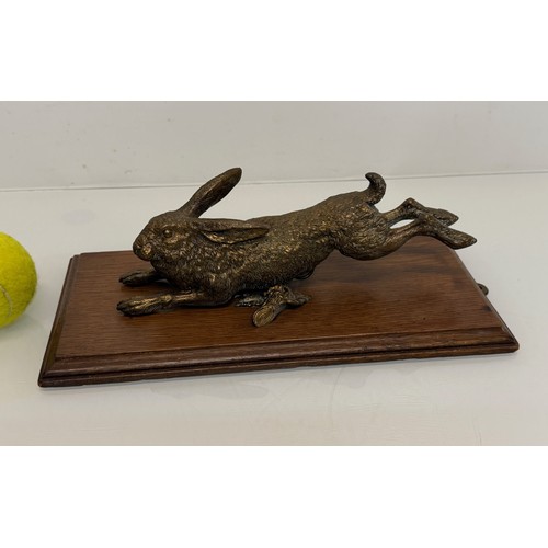 7 - Austrian school C19th century bronze, a cast and sprung paper clip in the form of a leaping hare, de... 
