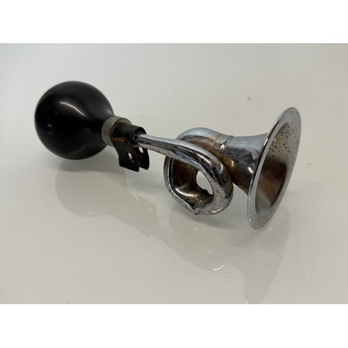 231 - Automobilia, a cycle or small motorcycle bulb type horn.

This lot is available for in-house shippin... 