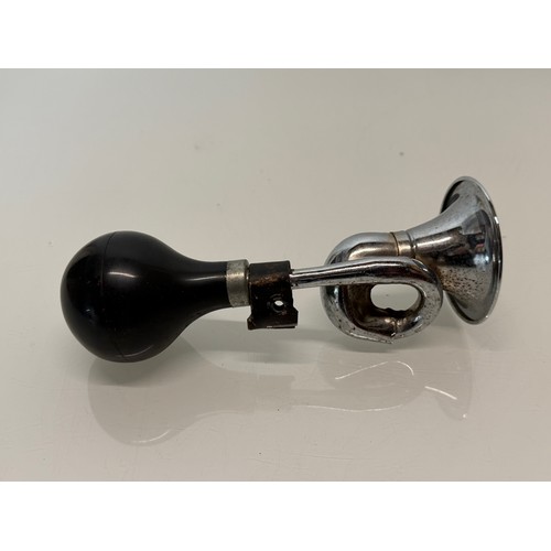 231 - Automobilia, a cycle or small motorcycle bulb type horn.

This lot is available for in-house shippin... 