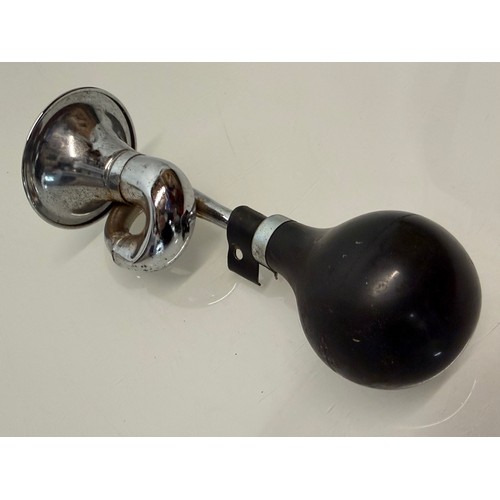 231 - Automobilia, a cycle or small motorcycle bulb type horn.

This lot is available for in-house shippin... 