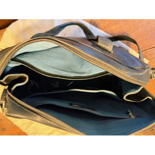 202 - Vintge fashions, accessories, a leather Radley handbag, with origional storage bag.

This lot is ava... 