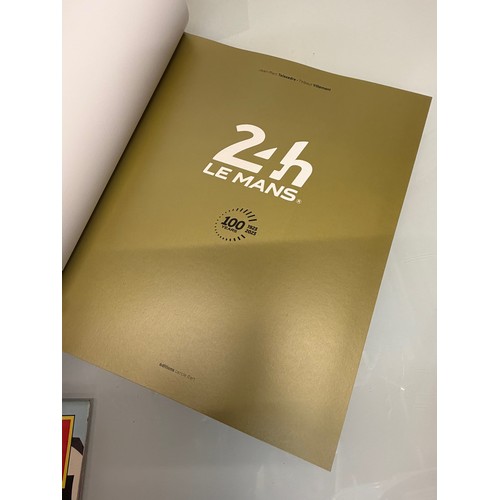 238 - Automobilia, motor racing, A book celerating one hundred years of the 24 hour motor race at Le Mans.... 