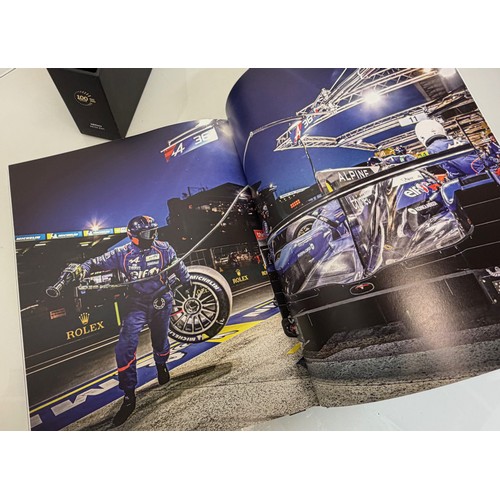 238 - Automobilia, motor racing, A book celerating one hundred years of the 24 hour motor race at Le Mans.... 