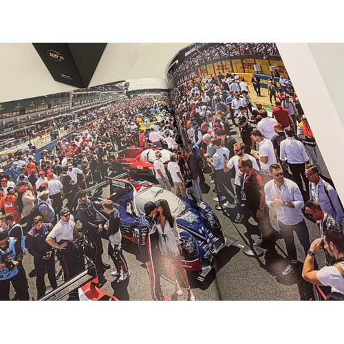 238 - Automobilia, motor racing, A book celerating one hundred years of the 24 hour motor race at Le Mans.... 