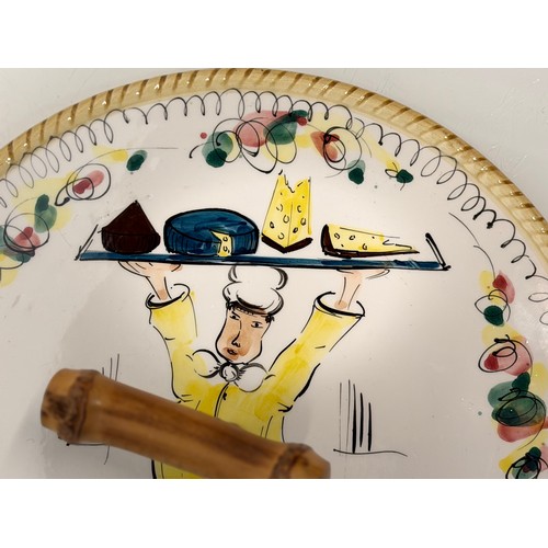 381 - Mid century table wares, a kitch serving platter decorated with an image of a jolly chef, 21 cm in d... 