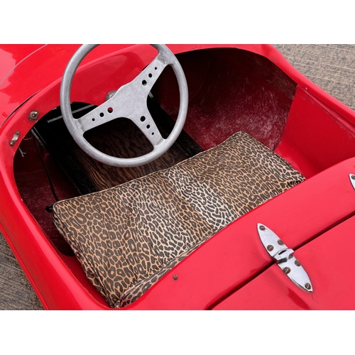 229 - Automobilia, racing car, toy car,  pedal car, a Jaguar XKSS ride in petrol engined Cheetah Cub from ... 