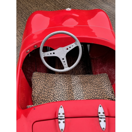 229 - Automobilia, racing car, toy car,  pedal car, a Jaguar XKSS ride in petrol engined Cheetah Cub from ... 